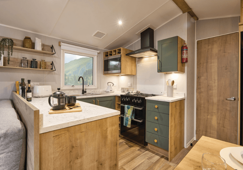 See the 2026 Green Willerby Sierra at Ideal Caravans Langley Moor. 38x12 stylish holiday home with open-plan living, king-size bed, and modern design. Large Image 2